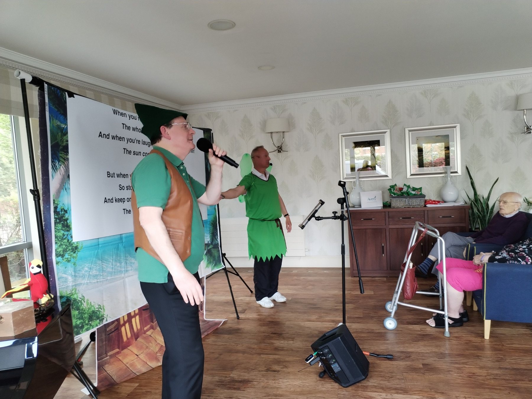 Nice n Easy performing a pantomime in a care home lounge